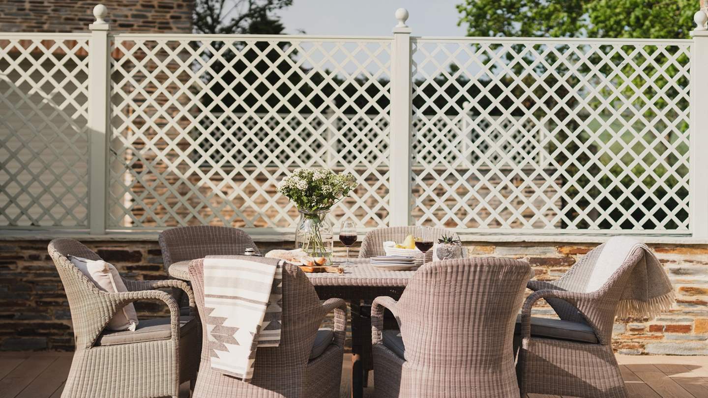 For outdoor dining on balmy summer days there's a table and chairs plus a BBQ