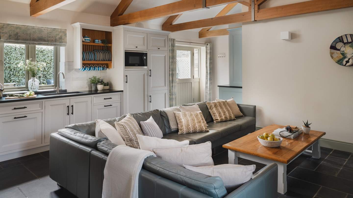 The elegant living space feels both grounded and quietly luxurious 