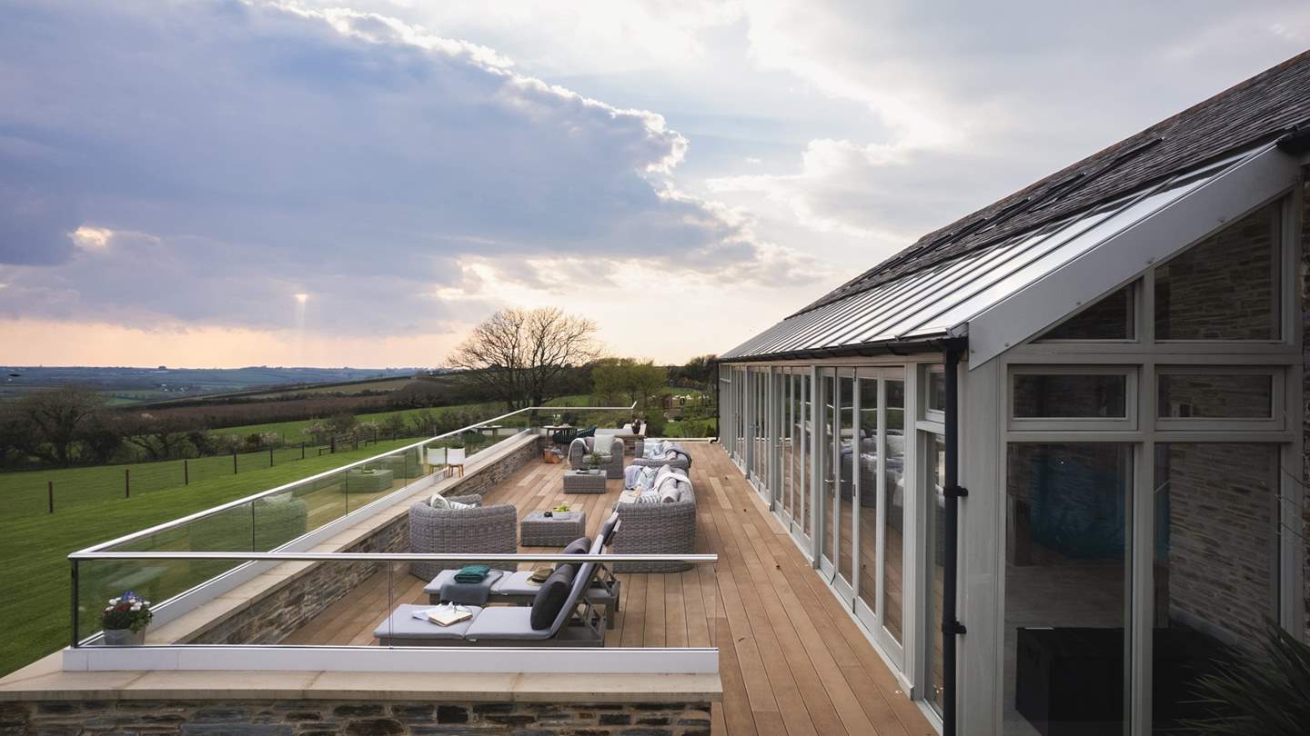 Lounge poolside or take decadent dips, before heading onto the decking area outside to savour far-reaching views across rolling countryside scenes