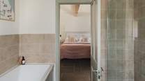 This bedroom benefits from an en suite bath and shower