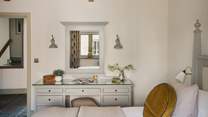 An elegant dressing table sits to entrance of this room