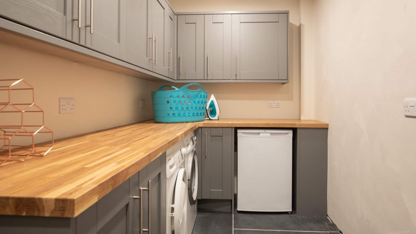 There's a utility room downstairs with a freezer and washer dryer and it's an excellent storage spot