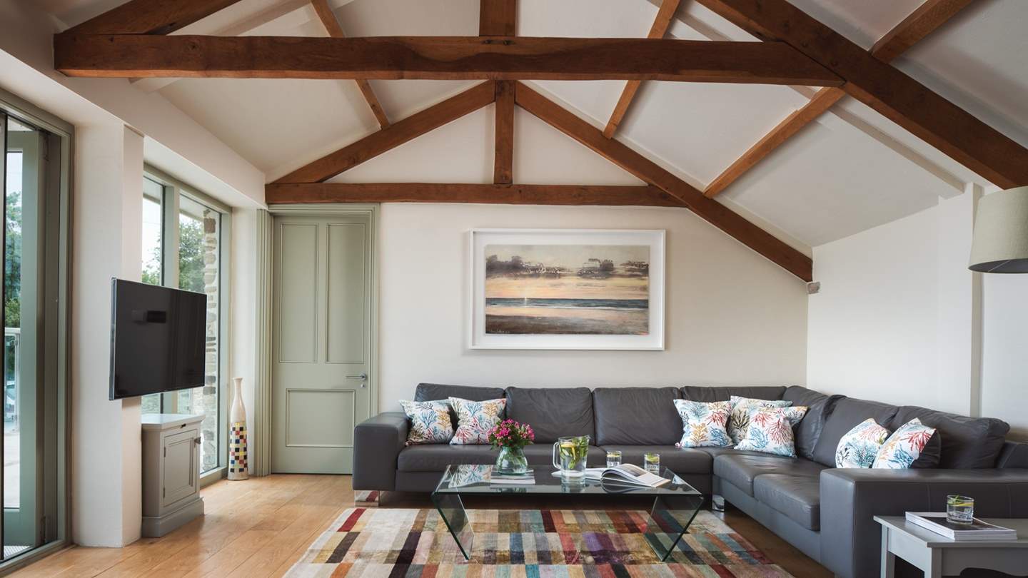 The huge sofa means there's plenty of room for everyone to relax