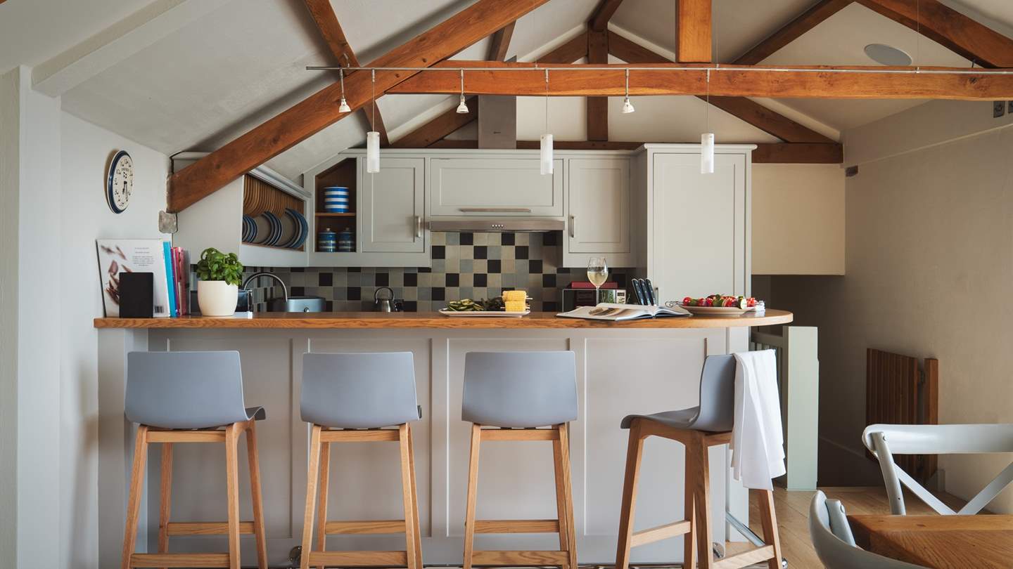 The breakfast bar is the perfect spot for snacks on the go or watching the chef at work