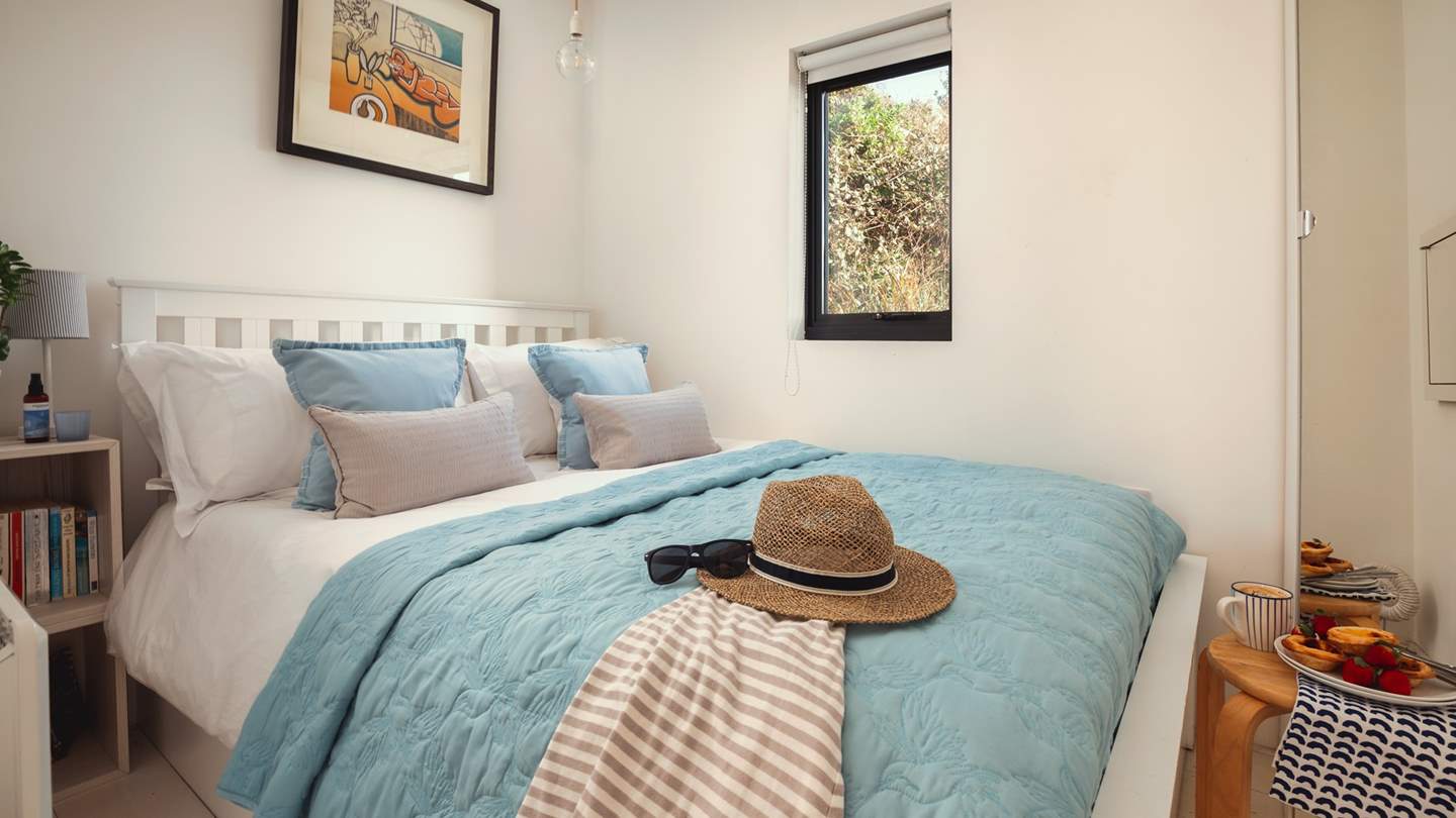 Relish slow mornings in the beautiful and bright bedroom at Sealight, with a coffee to begin your perfect day of beach exploring.