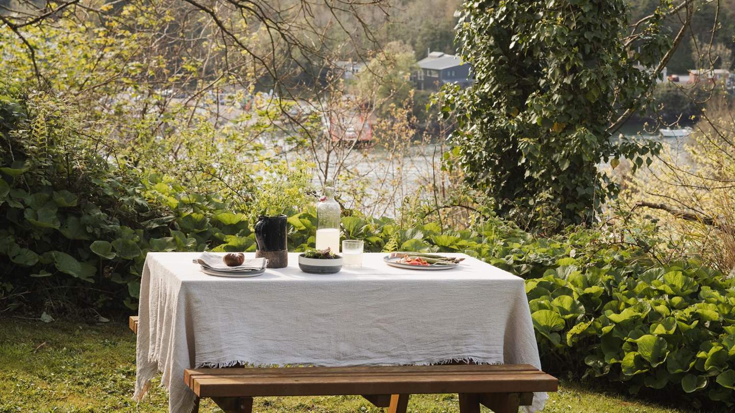 The adorable secret garden is the perfect place to enjoy views over the river