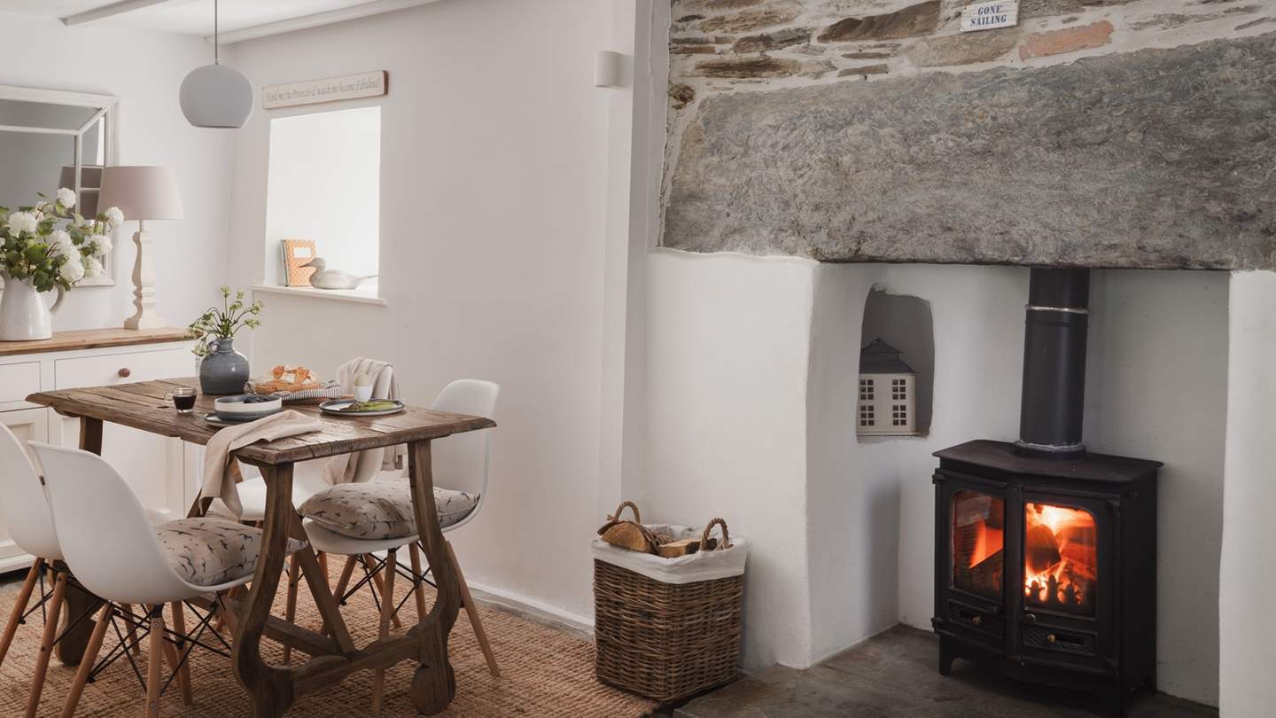 An exposed stone feature wall and original slate floors ensure endless cottagecore