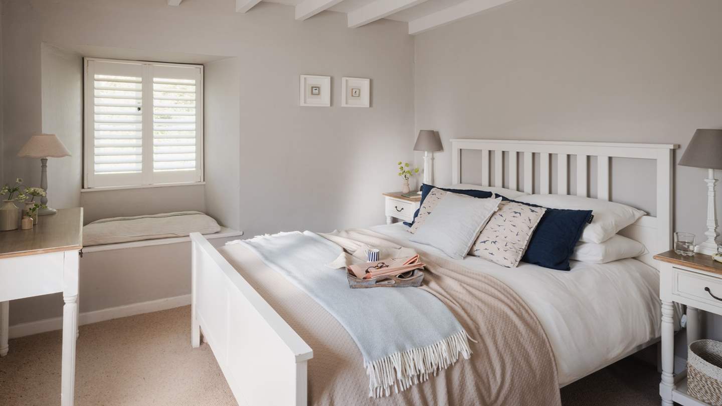 We adore the character of the bedroom, dressed in soothing tones