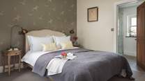 The pretty king size master bedroom, with en suite shower room
