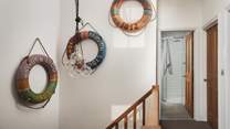 Pass the vintage life rings up to the first floor where you'll find the bedrooms