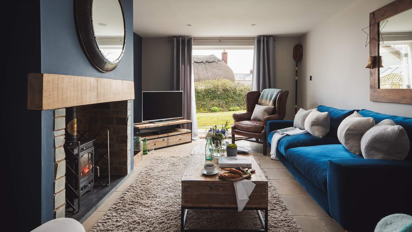 The sumptuous blue velvet sofa is calling us to curl up in...