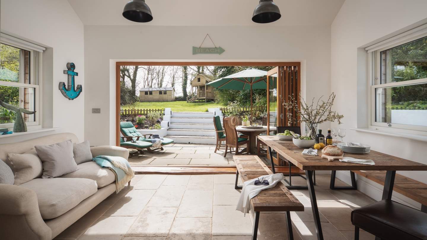 We love the dining area, complete with the trestle-style dining table and benches