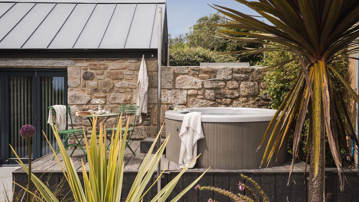 Outside, uncover soul-soothing spaces for relaxing alfresco with a bubbling hot tub 