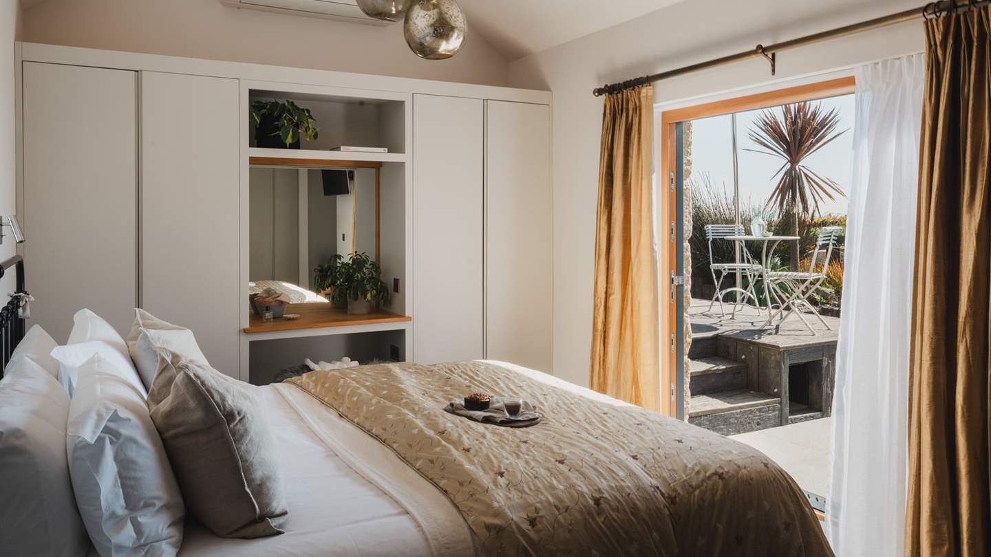  Large bi-fold doors lead onto the patio, inviting the outside in during the warmer months