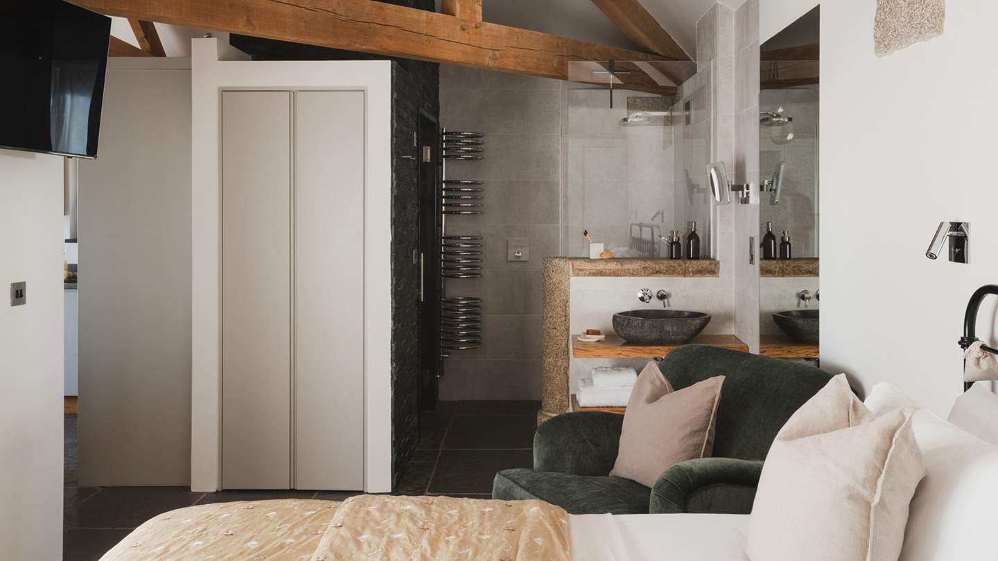 Adjoining the bedroom you'll find a sleek shower room