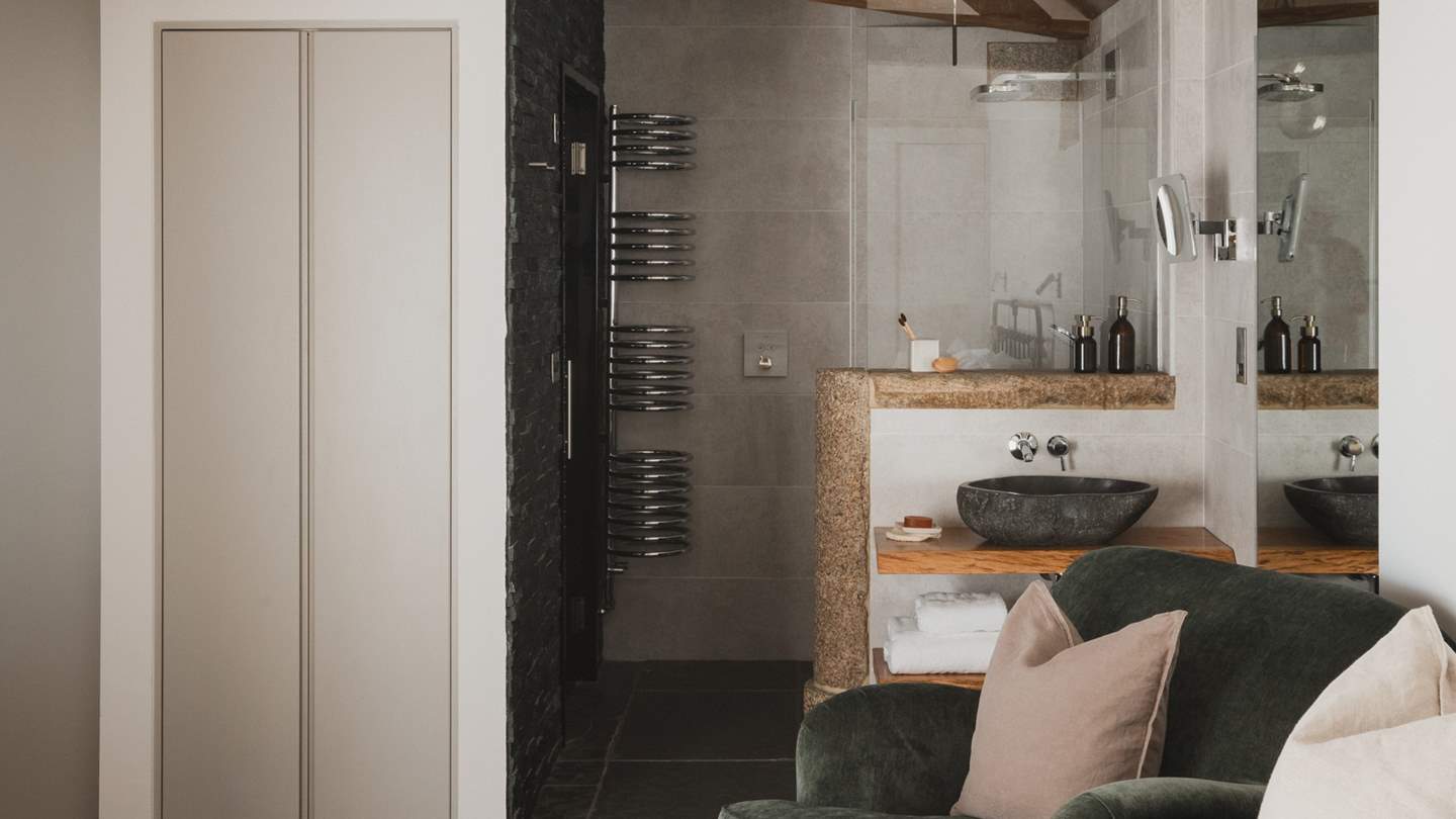 Uncover a walk-in rainfall shower, with the addition of a heated towel rail and underfloor heating
