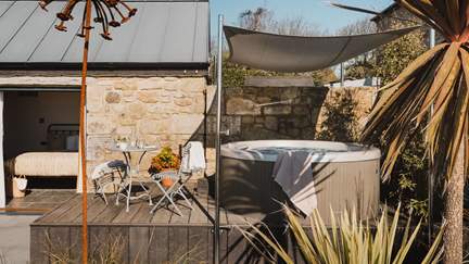 Outside, uncover soul-soothing spaces for relaxing alfresco, with a bubbling hot tub and outdoor seating to soak up the sun in the warmer months