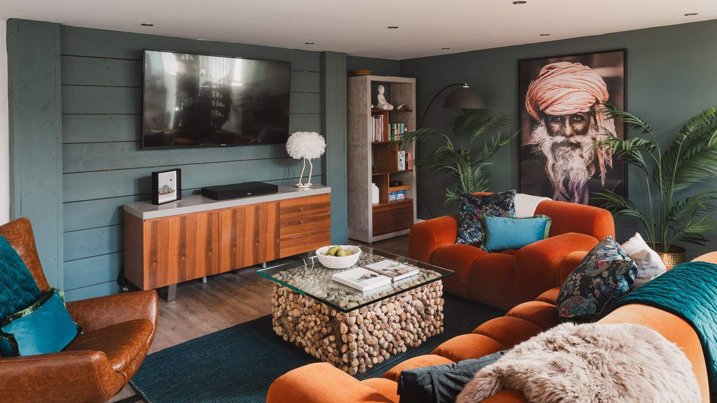 Open plan living makes the most of the vaulted ceilings, whilst carefully chosen furniture and fab kitchen compliment rather than clash with the original feature