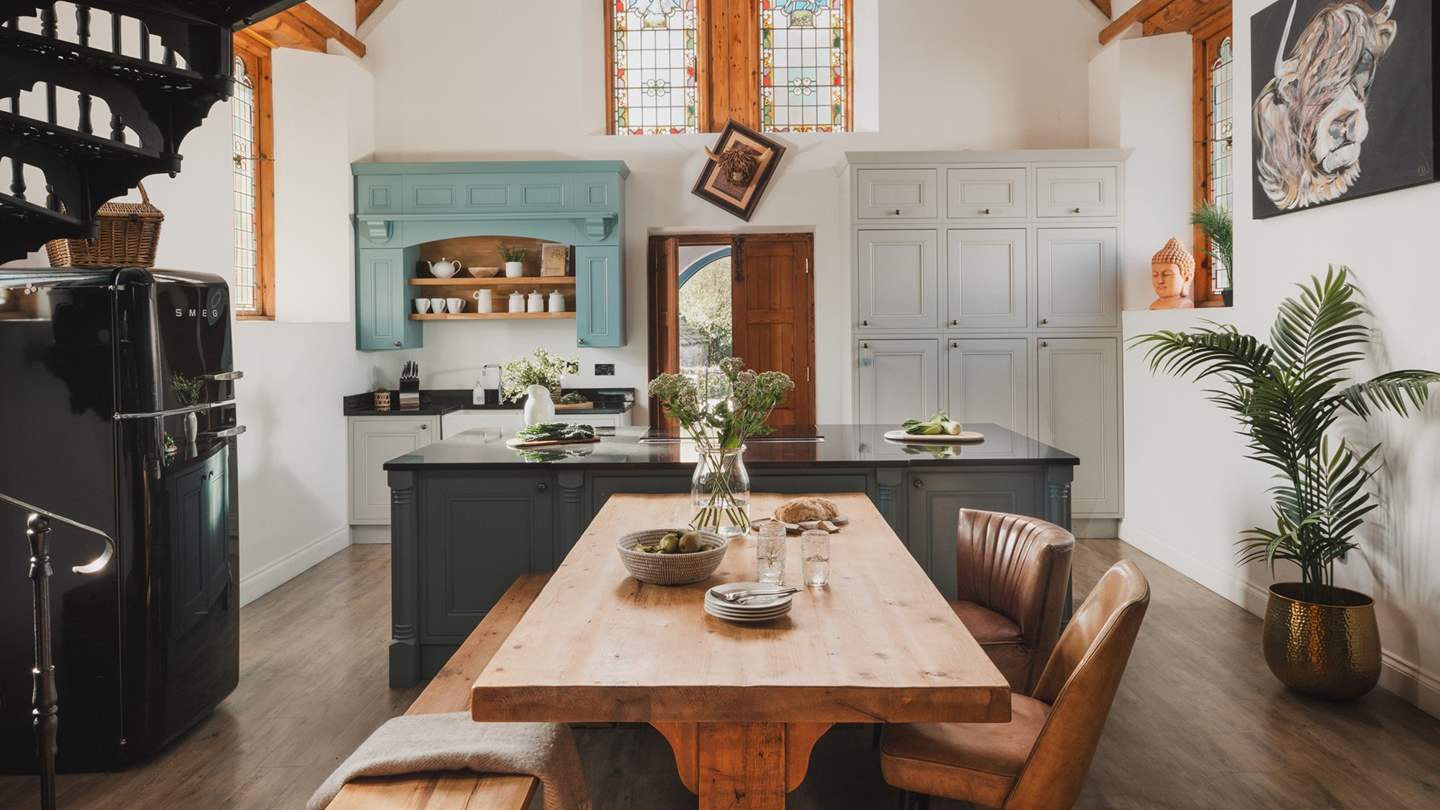 Step through the sky blue doors and you'll be transfixed by the stunning, airy space flecked by the jewel-coloured light from the stained glass windows