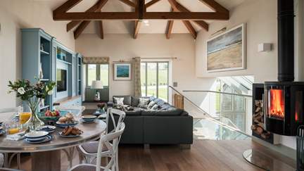 We just love the open plan living, with huge vaulted ceiling and exposed beams at Trevear Mill House
