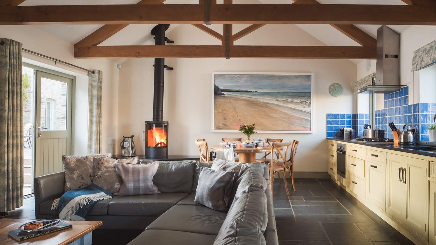 Enjoy cosy mealtimes around the dining table, set handily close to the kitchen