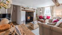 The large inglenook fireplace and wood burner makes this sitting room super cosy and warm.