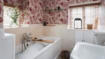 Tucked away downstairs you'll find the pretty bathroom 