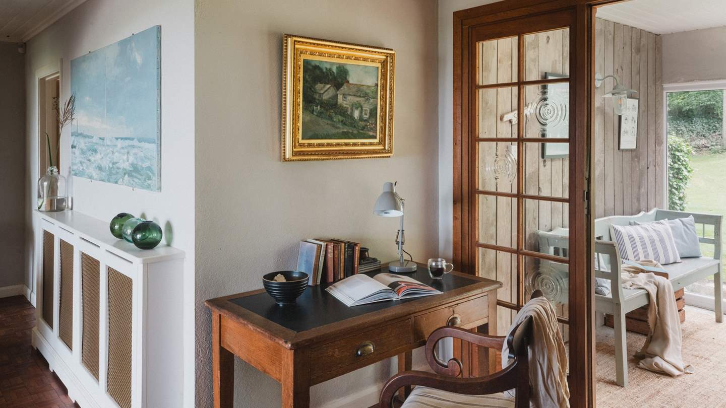 We adore the antique desk and characterful chair, a space to put pen to paper