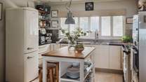 Tempting for aromatic meals, the attractive kitchen has everything you need for divine repasts