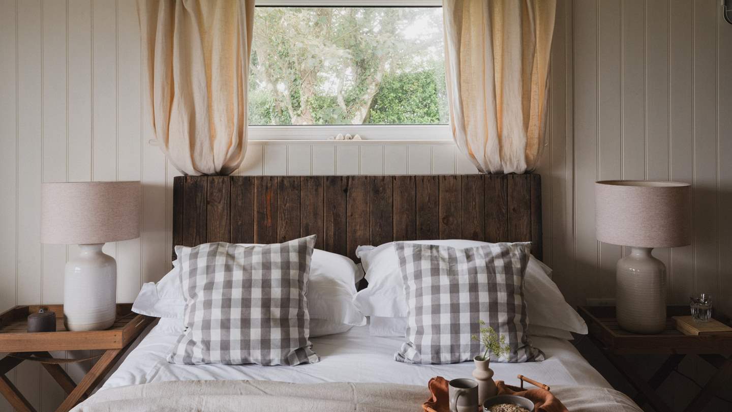 With cream cladding and soothing tones, and vintage wooden armchairs, it exudes elegant style and a restful ambience