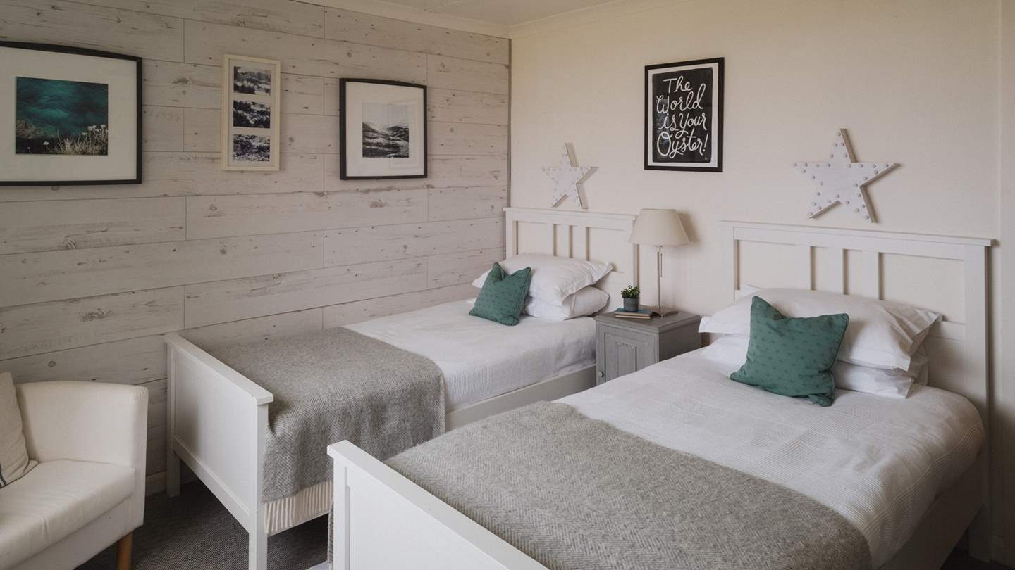 Heading upstairs, a third bedroom with twin beds proffers a tranquil resting spot