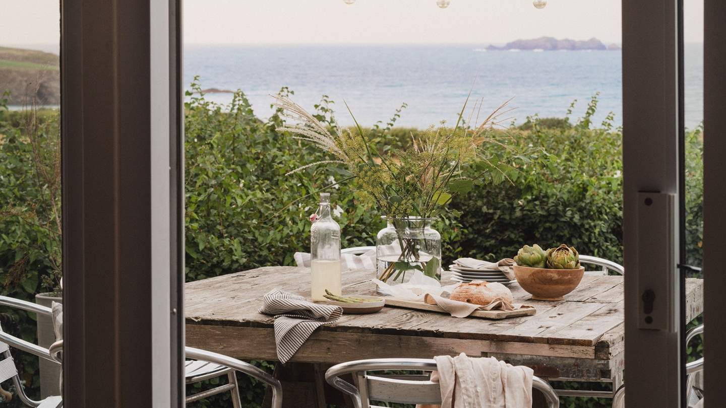 For alfresco dining at home, savour mealtimes on the raised decking area where a BBQ, table and chairs all reside