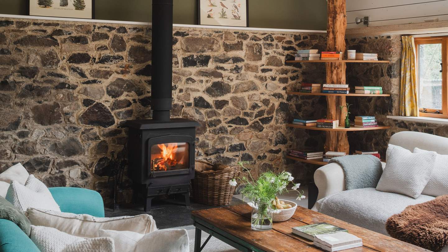 We love the eye-catching tree library; created by the clever owners, a pretty exposed tree trunk looks to pierce the room from top to bottom and holds plenty of books to read