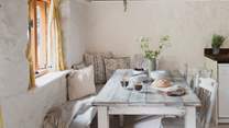 The dining table sits in the kitchen and seats six - perfect for long, leisurely meals