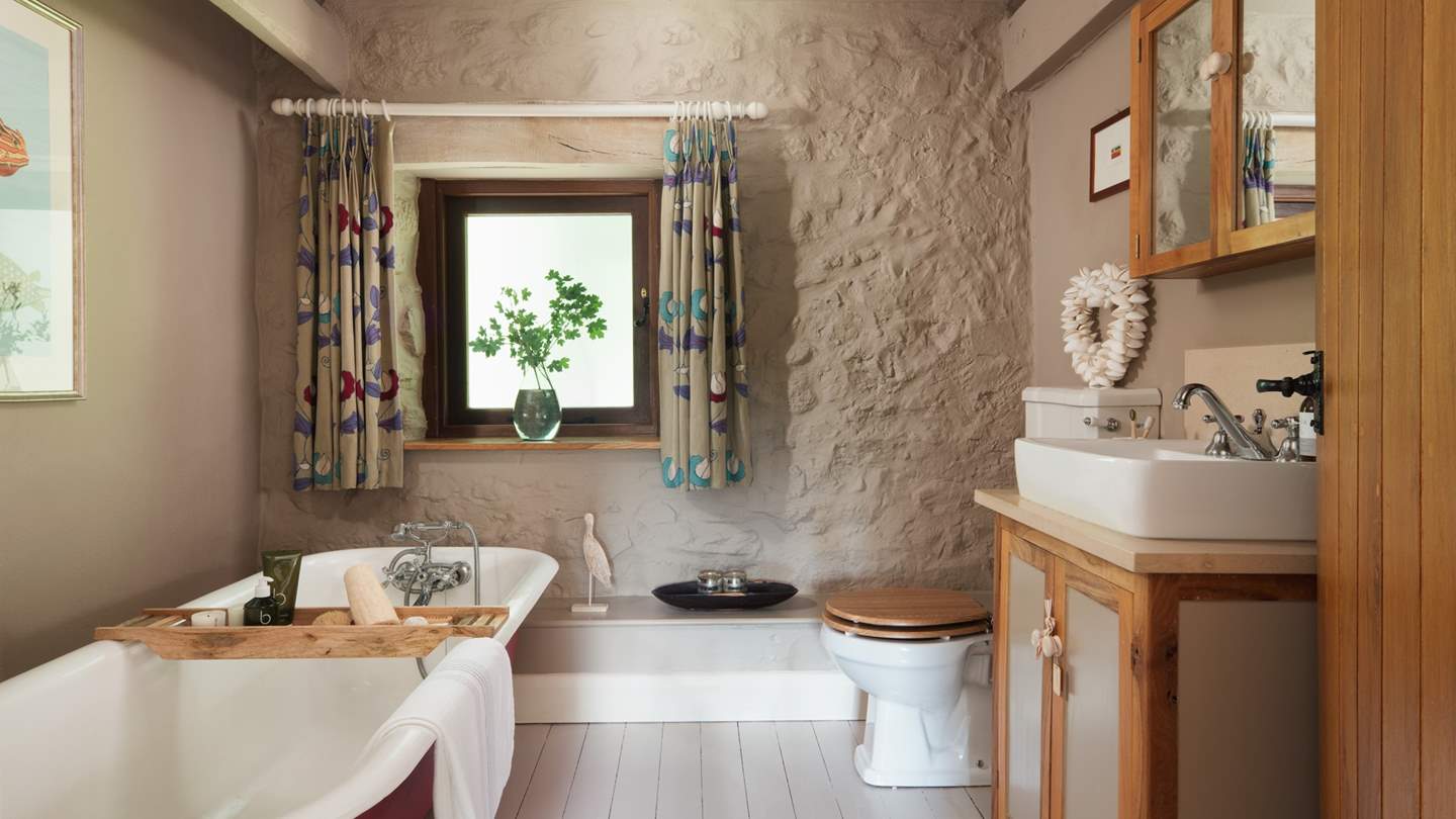 Unwind after a day exploring in a heavenly roll top bathtub