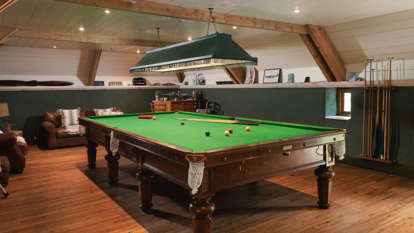 This fantastic room is complete with a full size snooker table, table tennis, table football, and even a beer fridge