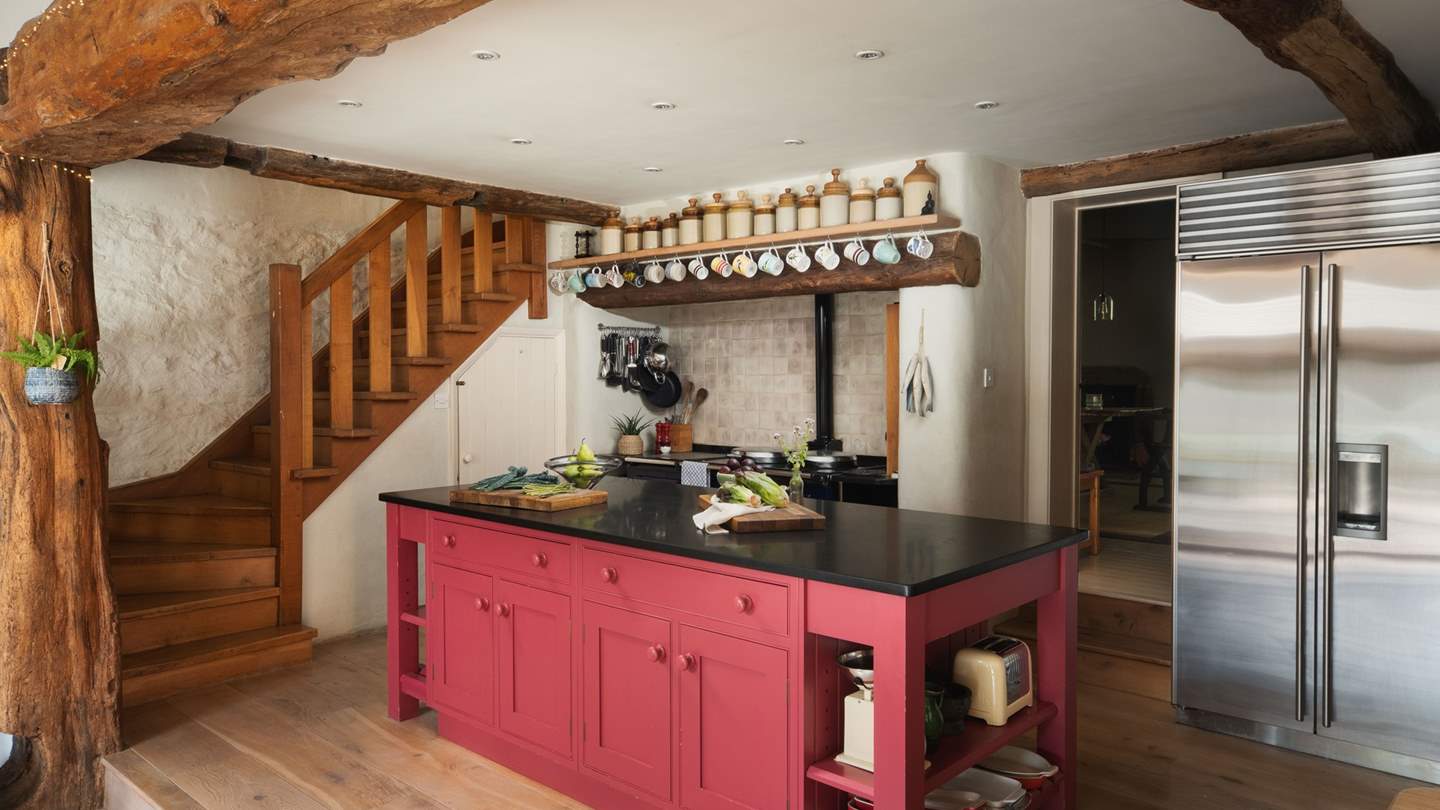 We love the gorgeous ceiling beams in the main kitchen, where you'll find a dreamy four oven Aga 