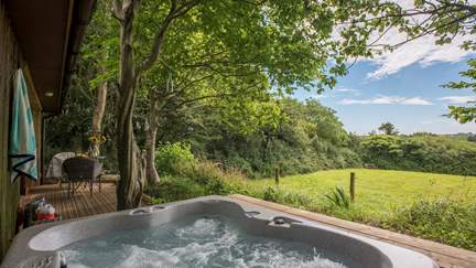 A gorgeous hot tub awaits you too - why not enjoy at night so you can gaze at the stars? Make sure to have a bottle of bubbles close by! 