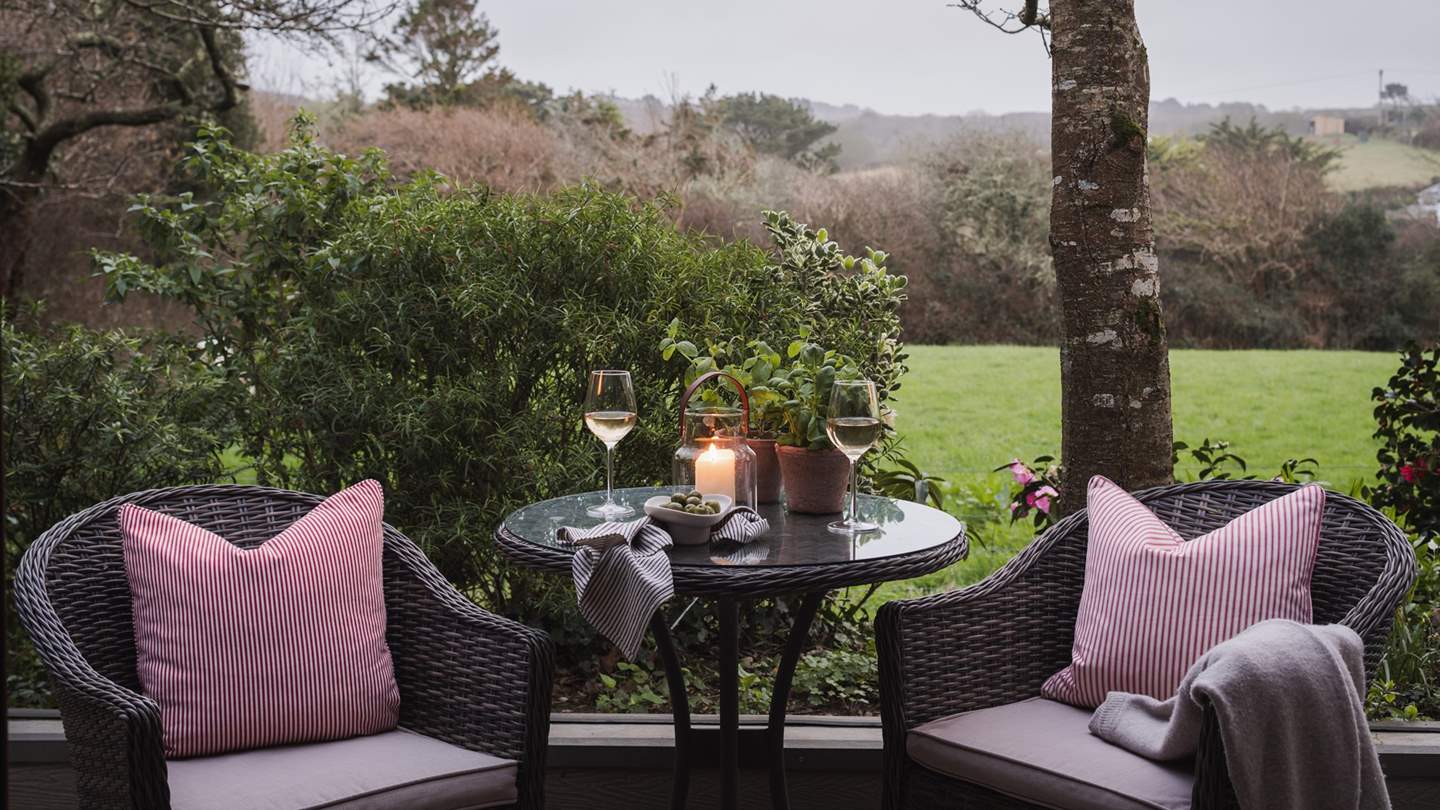 A long wooden deck, with dappled light from the overhanging trees, is a perfect spot for an alfresco breakfast, lunch or dinner or simply for a drink or two