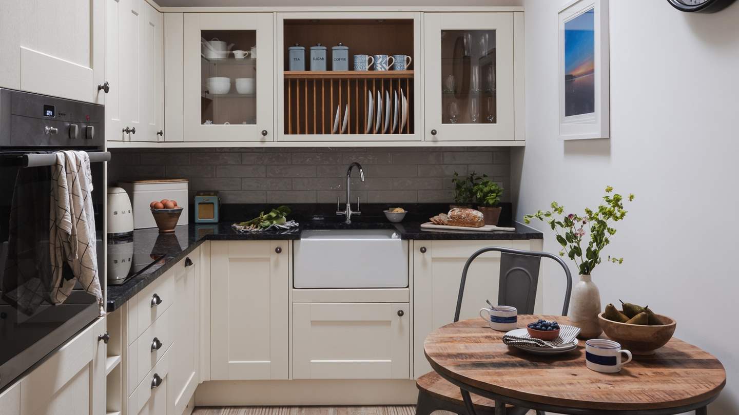 The darling dining table and chairs make for a romantic meal for two