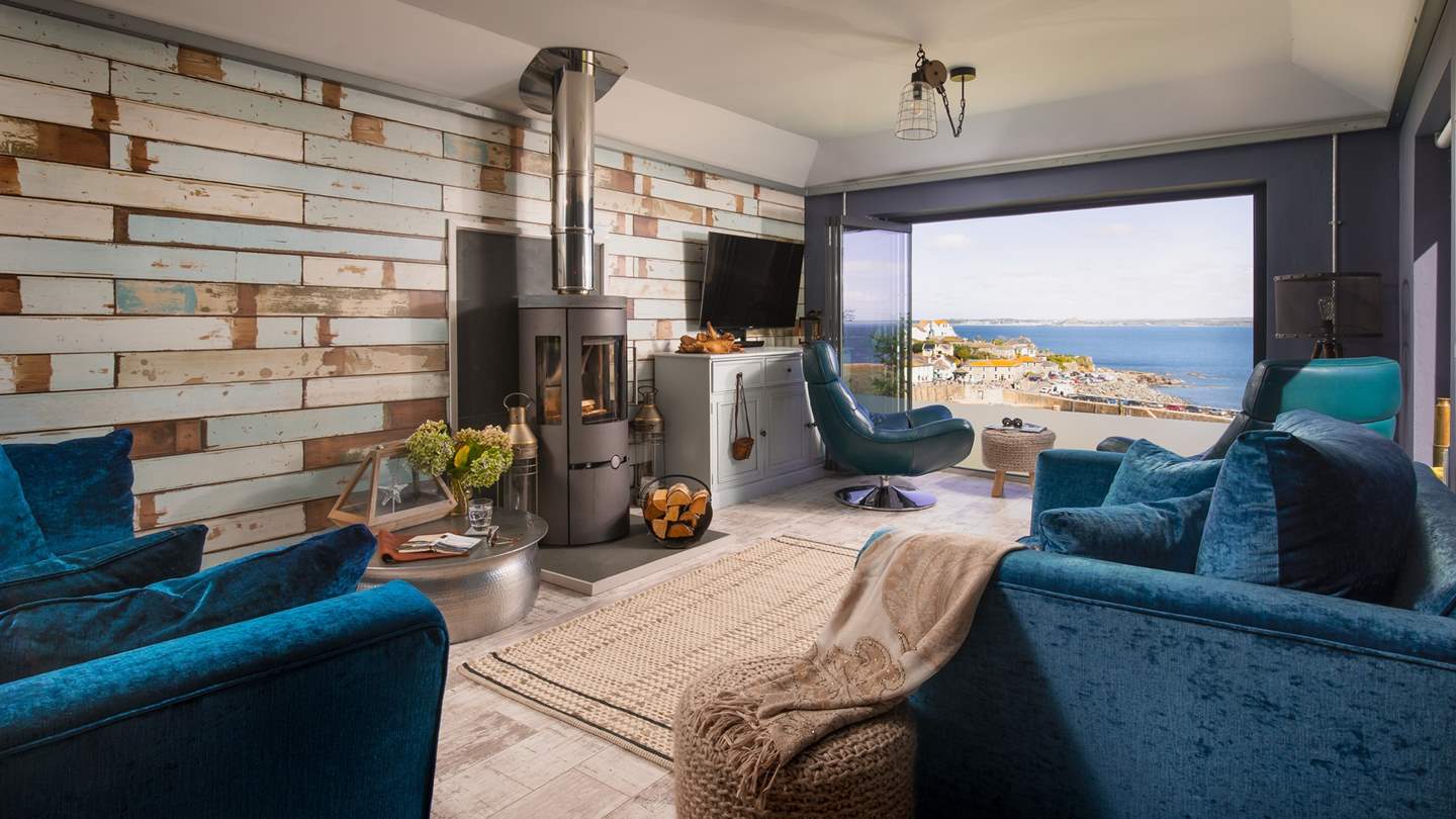 Drenched in light from the ceiling-high windows and glass concertina doors, a space designed for peaceful moments 