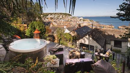 Unusual for Mousehole, Horizon comes with a spacious, enclosed tiered garden and a hot tub.