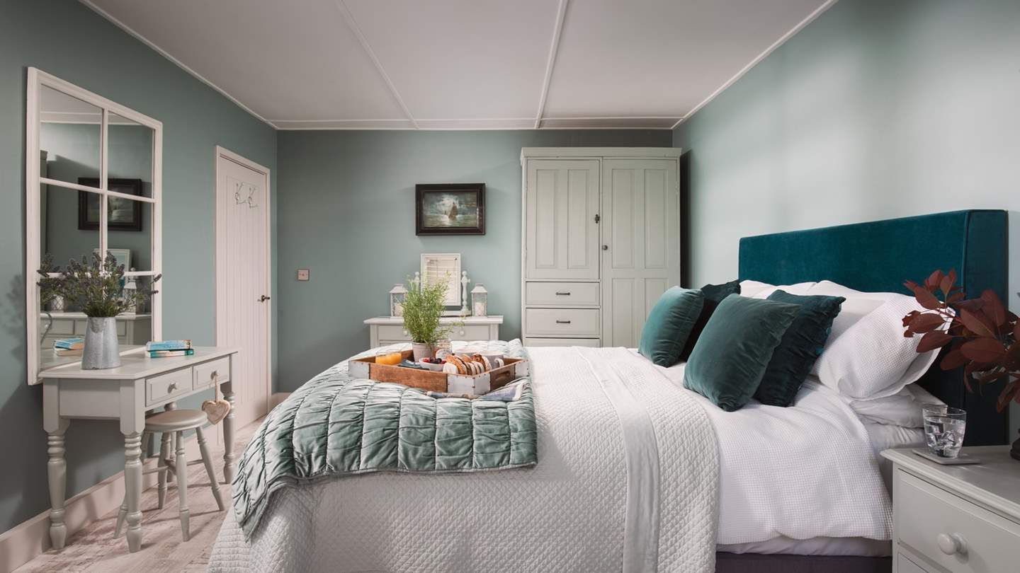 The master bedroom is downstairs to the front of the house to make the most of the gorgeous views