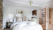 The ultimate country bedroom; luxury linens and a welcoming bed means you're guaranteed a peaceful nights' sleep.