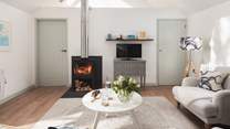 The flickering wood burner keeps things toasty warm on cooler days