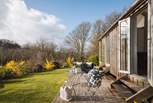 The sun-soaked deck is a perfect spot for whiling away a deliciously warm afternoon