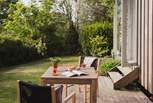 The sun-soaked deck is a perfect spot for whiling away a balmy afternoon