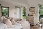 The sumptuous king sized bed, draped with gorgeous White Company linens, will help you drift off to sleep and bird call will gently wake you in the morning