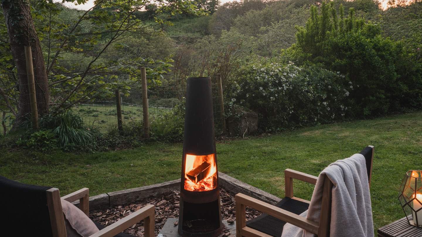 Outside you'll find a decking area complete with deckchairs and a table and chairs, a fire pit, and a gas barbecue - perfect for a spot of al fresco dining