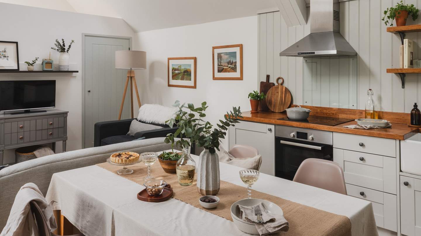 The dining table lies in the middle room and invites for a romantic dinner or a lazy Sunday breakfast